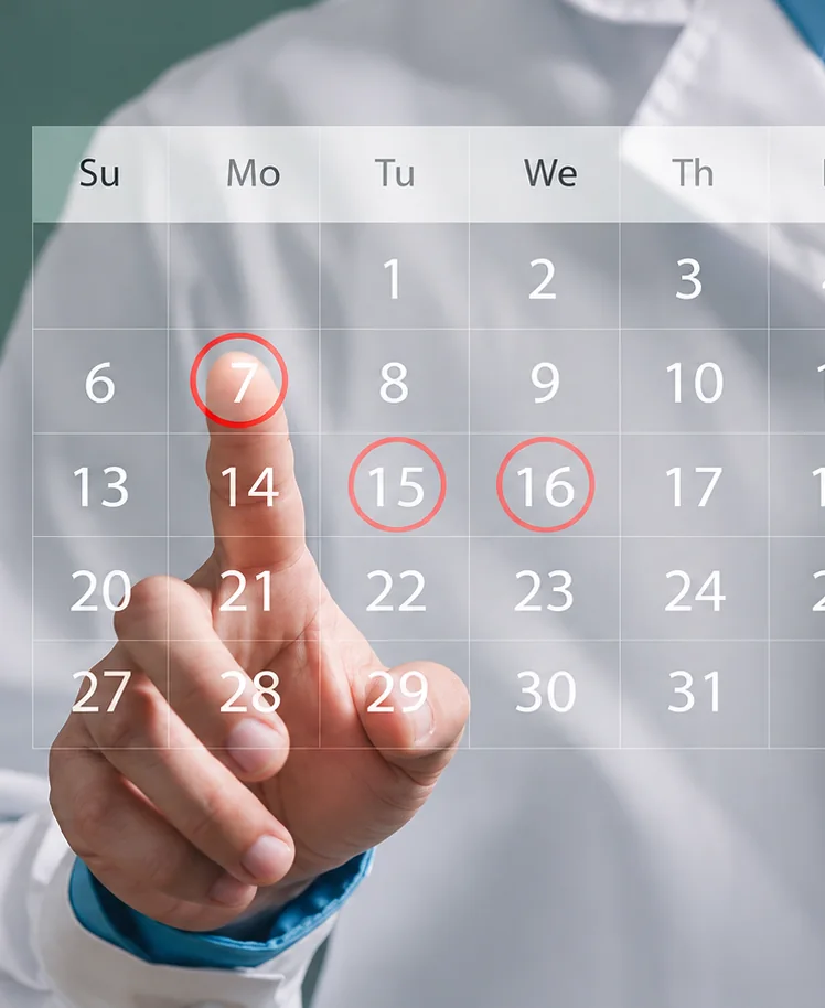 A doctor tapping a date on a digital calendar
