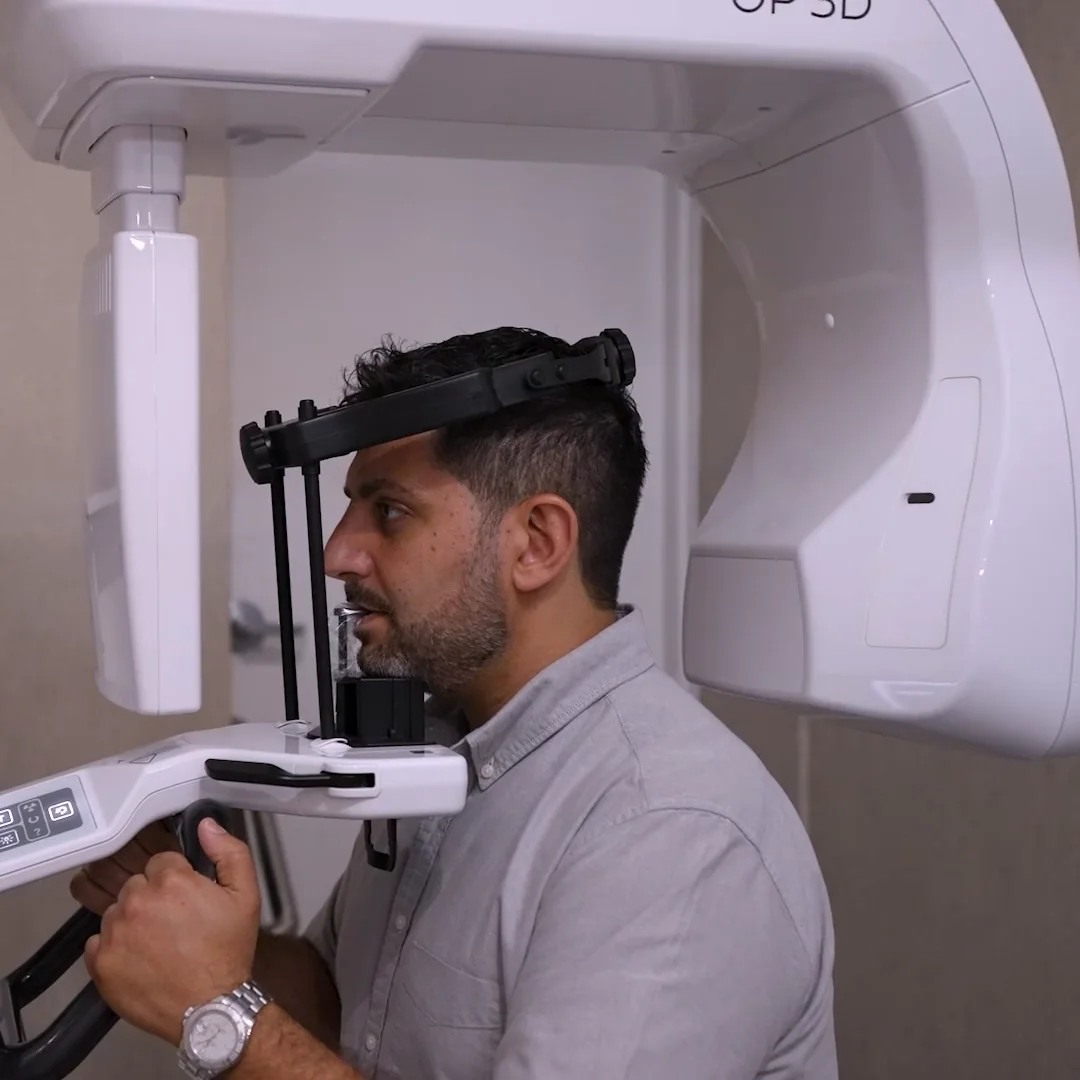 A patient positioned in the 3D cone beam CT scanner