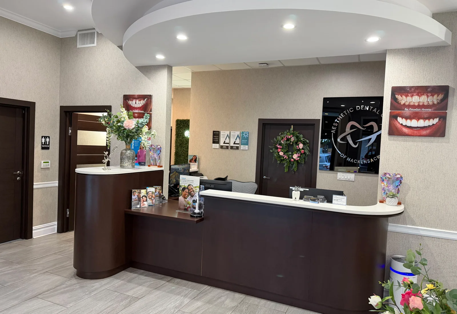 The curved reception desk under a round ceiling light
