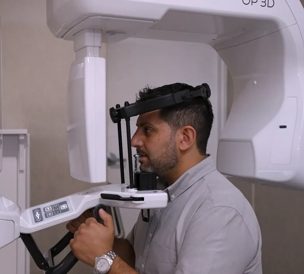 A patient positioned in the cone beam CT scanner