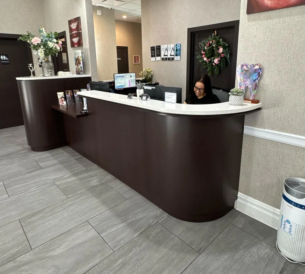 The curved reception desk of the practice