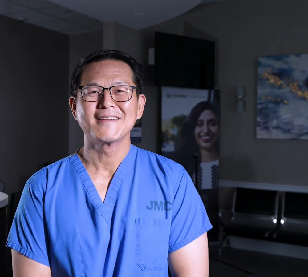 Dr. Won-Sang Lee in blue scrubs at the practice