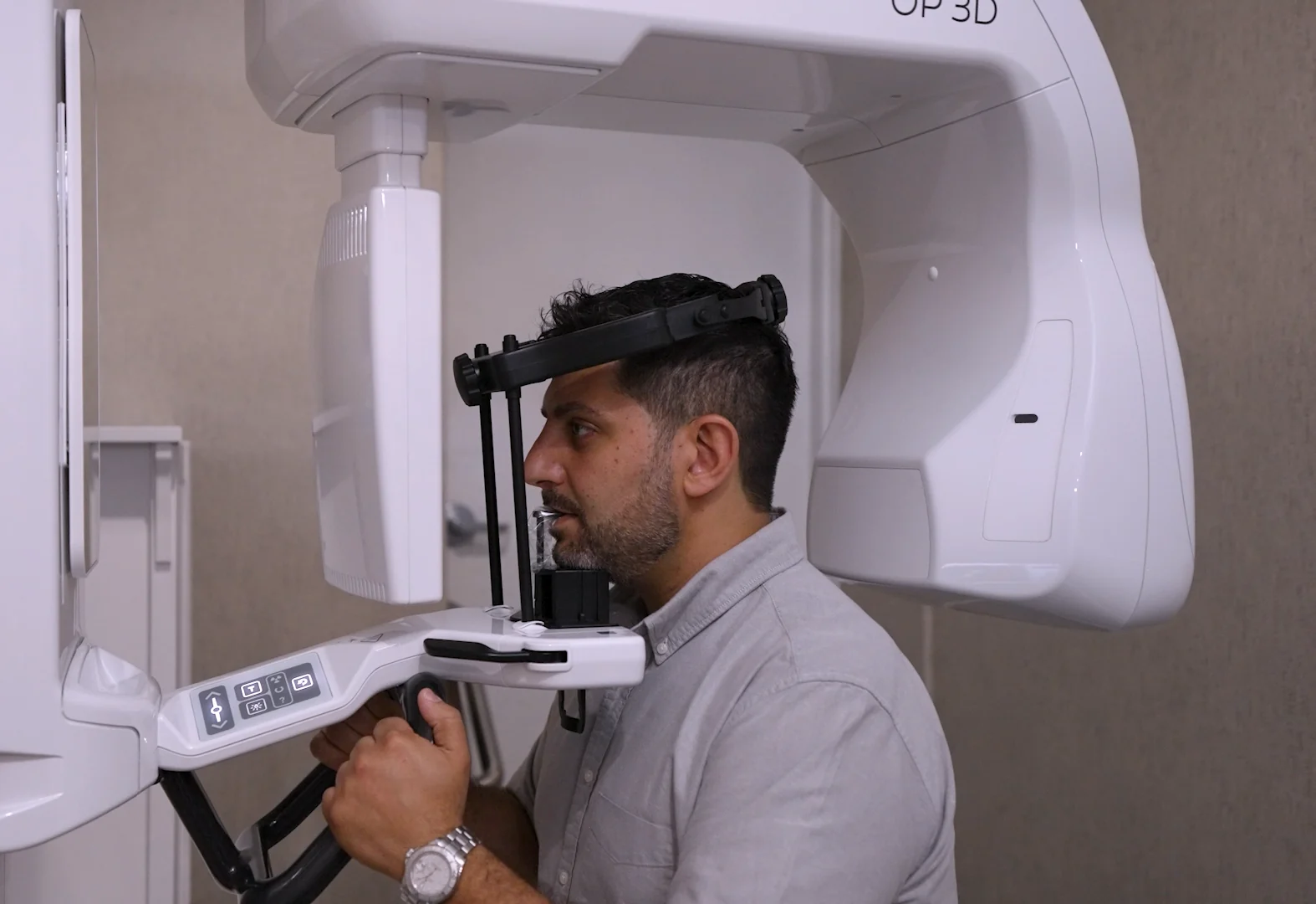 A patient positioned in the 3D CBCT scanner