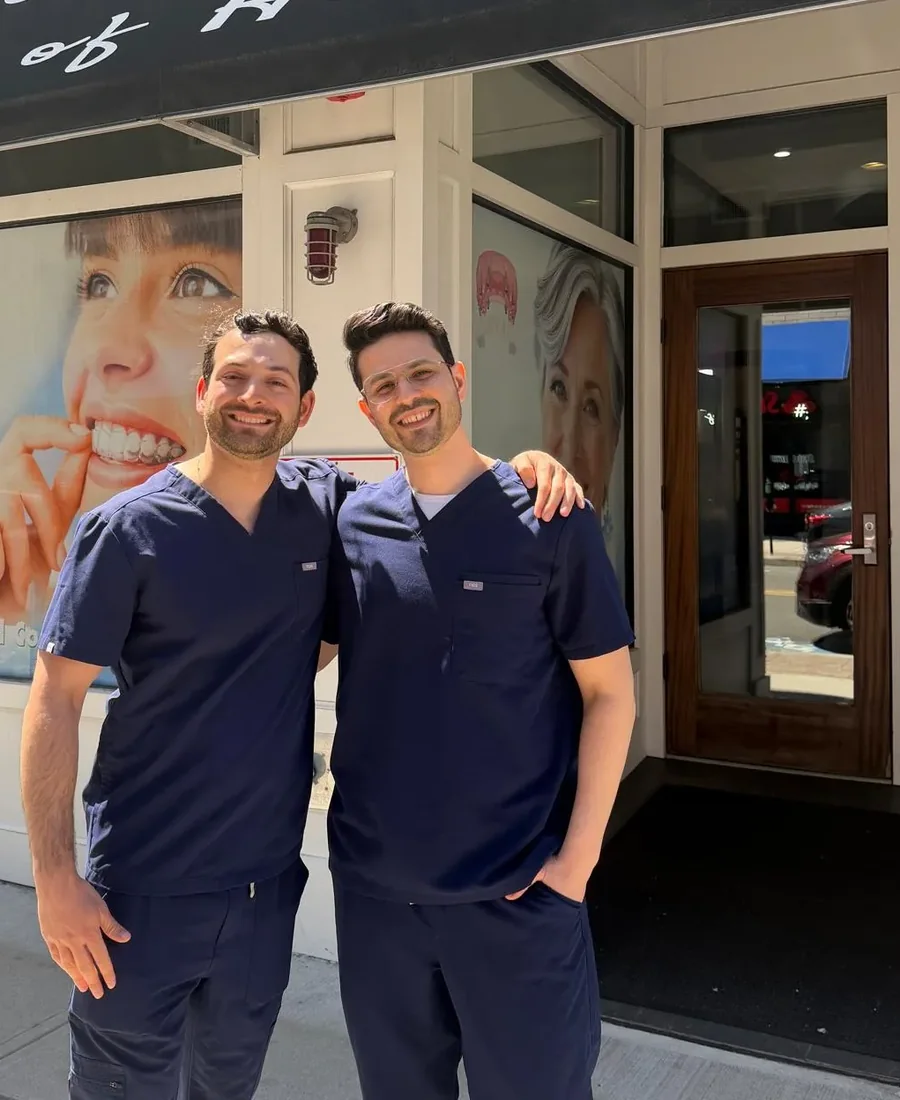 Dr. Alan Meskin with a colleague outside the practice